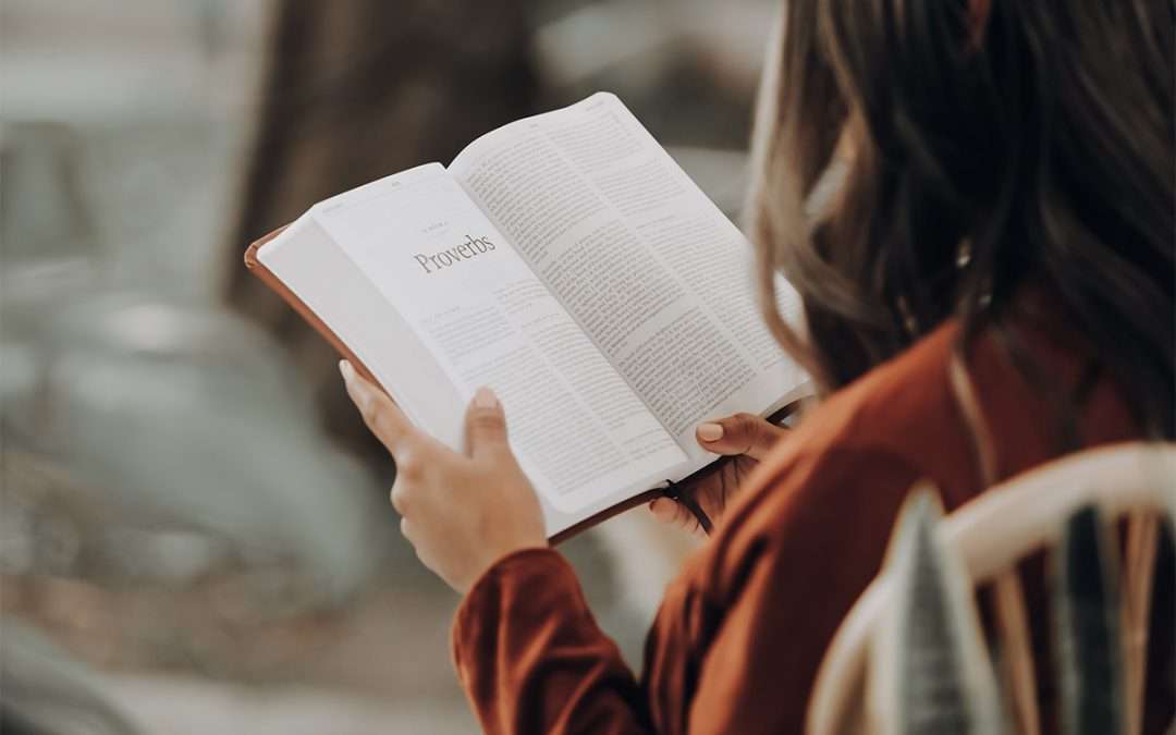 girl reading Bible